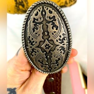 Brave leather belt with ornate buckle
